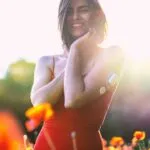 Woman in Orange Tube Dress Smiling